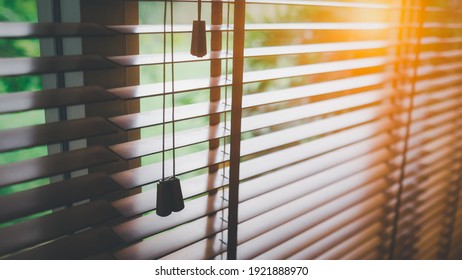 Wooden shutters blinds with sun light. Windows blinds. 
