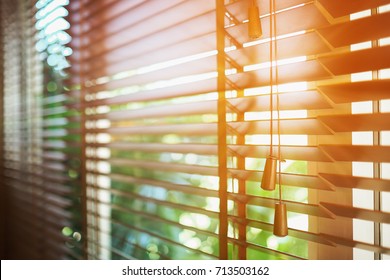Wooden shutters blinds with sun rays. Window blinds.  - Shutterstock ID 713503162