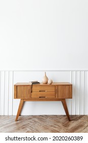 Wooden Sideboard Table With Books And A Vase