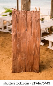 Wooden Sign Board On Sandy Floor