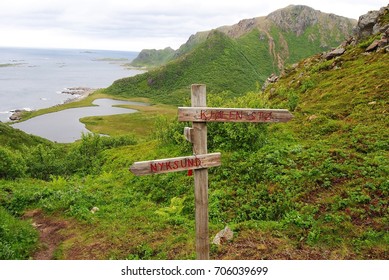 Wooden sign indicating directions to Nyksund and Sto in Vesteralen archipelago in Norway.