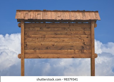 Wooden sign on a blue sky