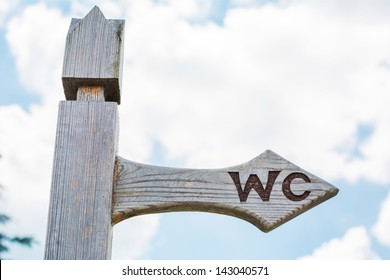 Wooden sign on the toilet against the sky - Shutterstock ID 143040571