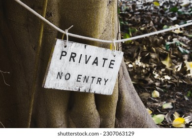A wooden sign painted white with the words Private No Entry written - Shutterstock ID 2307063129