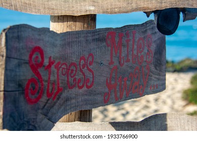 Wooden Sign Saying Stress Miles Away