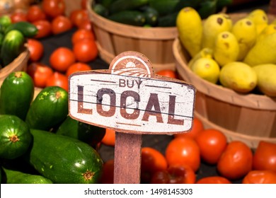 Wooden Sign With Word Signage Reading Buy Local Produce With Tomatoes Yellow Squash And Zucchini Background