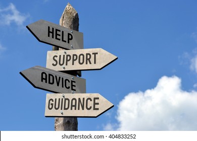 Wooden signpost with four arrows - "help, support, advice, guidance". Great for topics like customer support, assistance, business presentations etc.