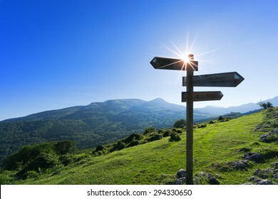 wooden signpost in the mountain