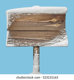 Wooden Signpost With Snow On It Isolated On Blue