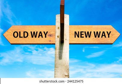 Wooden Signpost With Two Opposite Arrows Over Clear Blue Sky, Old Way And New Way Signs