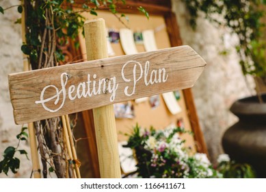 Wooden signposts at events and weddings with words Seating Plan.