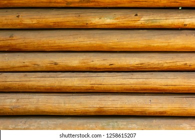 wooden slats with yellow undertones and dirt create patterned background - Shutterstock ID 1258615207