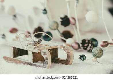 Wooden Sled With Snow, Christmas Garland And Cart