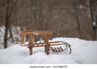 Wooden Sledge Stand On The Snow In Winter