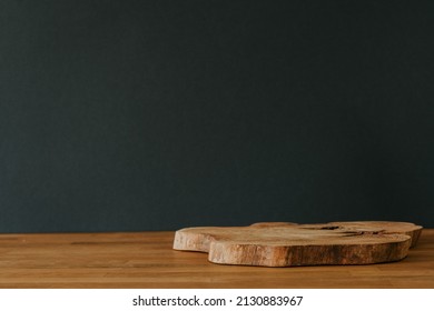 Wooden slice as a stand on a green background