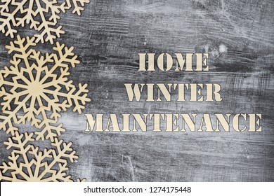 Wooden Snowflakes On A Weathered Wood With Winterization Message Of Home Winter Maintenance