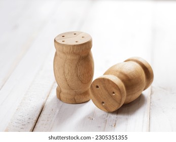 Wooden spicery set for salt and pepper on white background - Shutterstock ID 2305351355