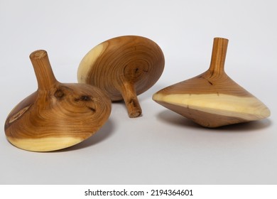 A Wooden Spinning Top On A White Table