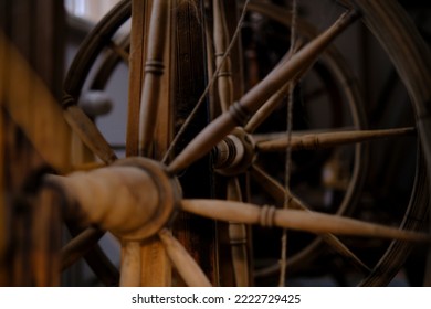 Wooden Spinning Wheel. The Traditional Method Of Making Woolen Threads