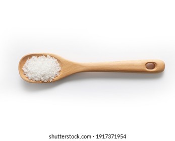 Wooden spoon with Bath salts on white isolated background.  Tea tree salt crystals. Foot soaks self care.  Eucalyptus salts.