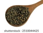 Wooden spoon of dried Puy lentils closeup isolated on white background