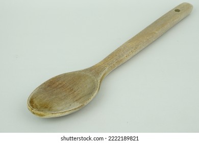 Wooden Spoon In Front Of A White Background