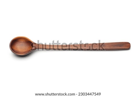 Wooden spoon isolated on white (Top view)