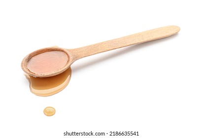 Wooden Spoon Of Maple Syrup On White Background