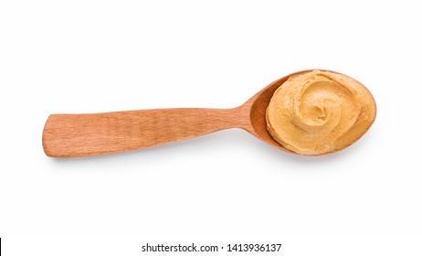 Wooden spoon with peanut butter isolated on white background, top view - Powered by Shutterstock