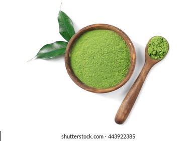 Wooden spoon with powdered matcha green tea in bowl, isolated on white