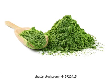 Wooden spoon with powdered matcha green tea, isolated on white
