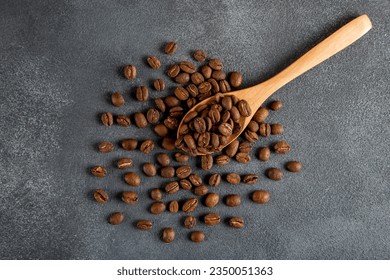 Wooden spoon with roasted coffee beans,top view - Powered by Shutterstock