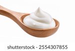 
Wooden spoon with sour cream isolated on a white background.