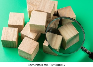 Wooden Square Blocks And Magnifying Glasses.