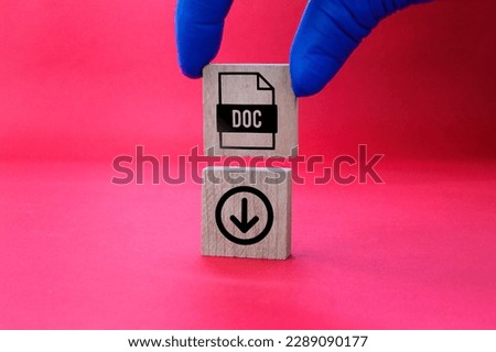 wooden square with DOC format file icon and download. the concept of save doc file. concept of document file format
