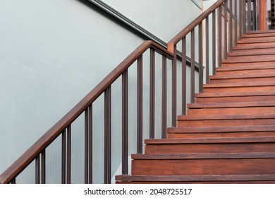 wooden stair and steel handrail.
