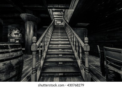 Wooden Staircase. Interior Of Old Pirate Ship. Black And White Image