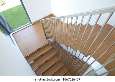 Wooden Staircase With Iron Banister In Modern House.
Solid Wood.