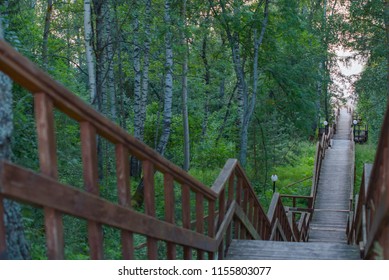 wooden staircase leading down to the river - Powered by Shutterstock