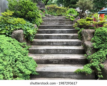 Wooden stairs in a green garden - Powered by Shutterstock