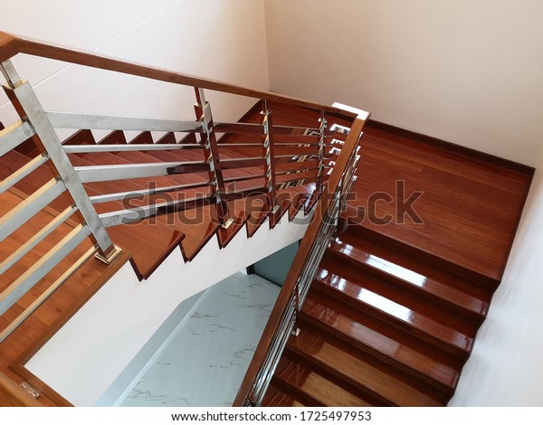 Wooden stairs at modern office, Interiors\
design.Wooden and elegant steps in house.stairs,is a construction\
designed to bridge a large vertical distance by dividing it into\
smaller distance call\
steps