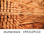 Wooden stakes stacked in the warehouse of a lumber company