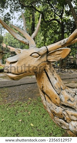 Wooden Statue in Garden Park
