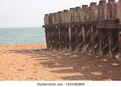 Wooden stays on a beach 