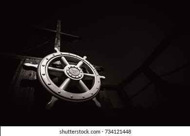 Wooden steering wheel on an old ship