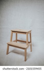 A Wooden Step Stool Ion White Background