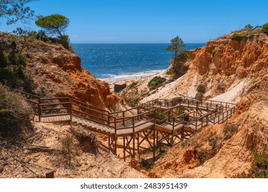 Wooden steps descending to Praia da Falesia beach the Algarve, Portugal beautiful beach near Vilamoura and Albufeira - Powered by Shutterstock