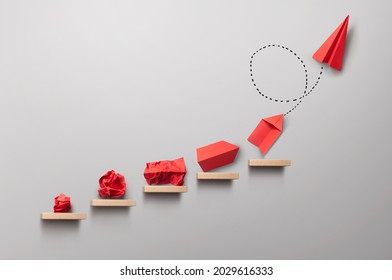Wooden steps with different stages of making a paper airplane, creating something from nothing success concept - Powered by Shutterstock