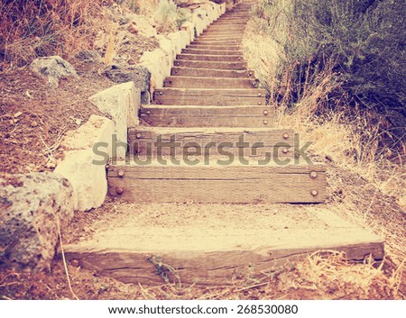  wooden steps going up a hill toned with a retro vintage instagram filter effect app or action 