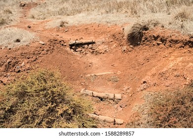 Wooden steps into an arid and desertic path with red clay (Madeira, Portugal, Europe) - Powered by Shutterstock